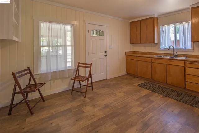 a view of a livingroom with furniture and windows