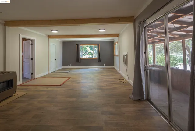 a view of a hallway with a window