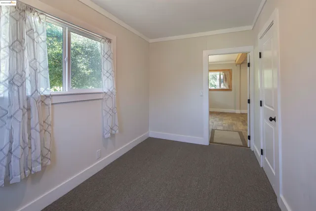 an empty room that has a window