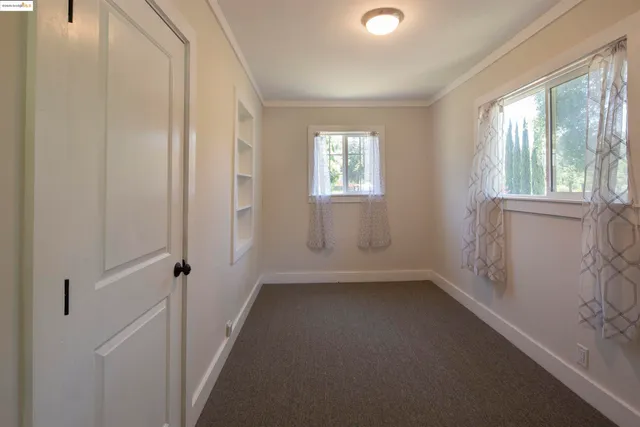 a view of a room that has a window in it