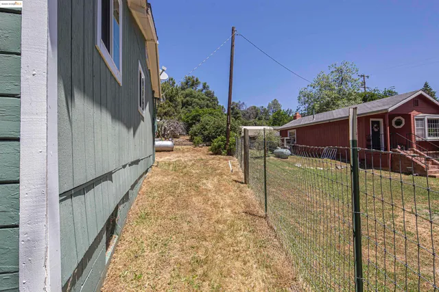 a view of a backyard of a house