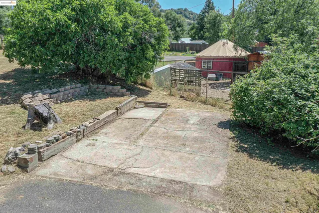 a view of a mountain range with lush green forest