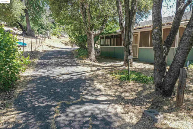 a backyard of a house with lots of green space