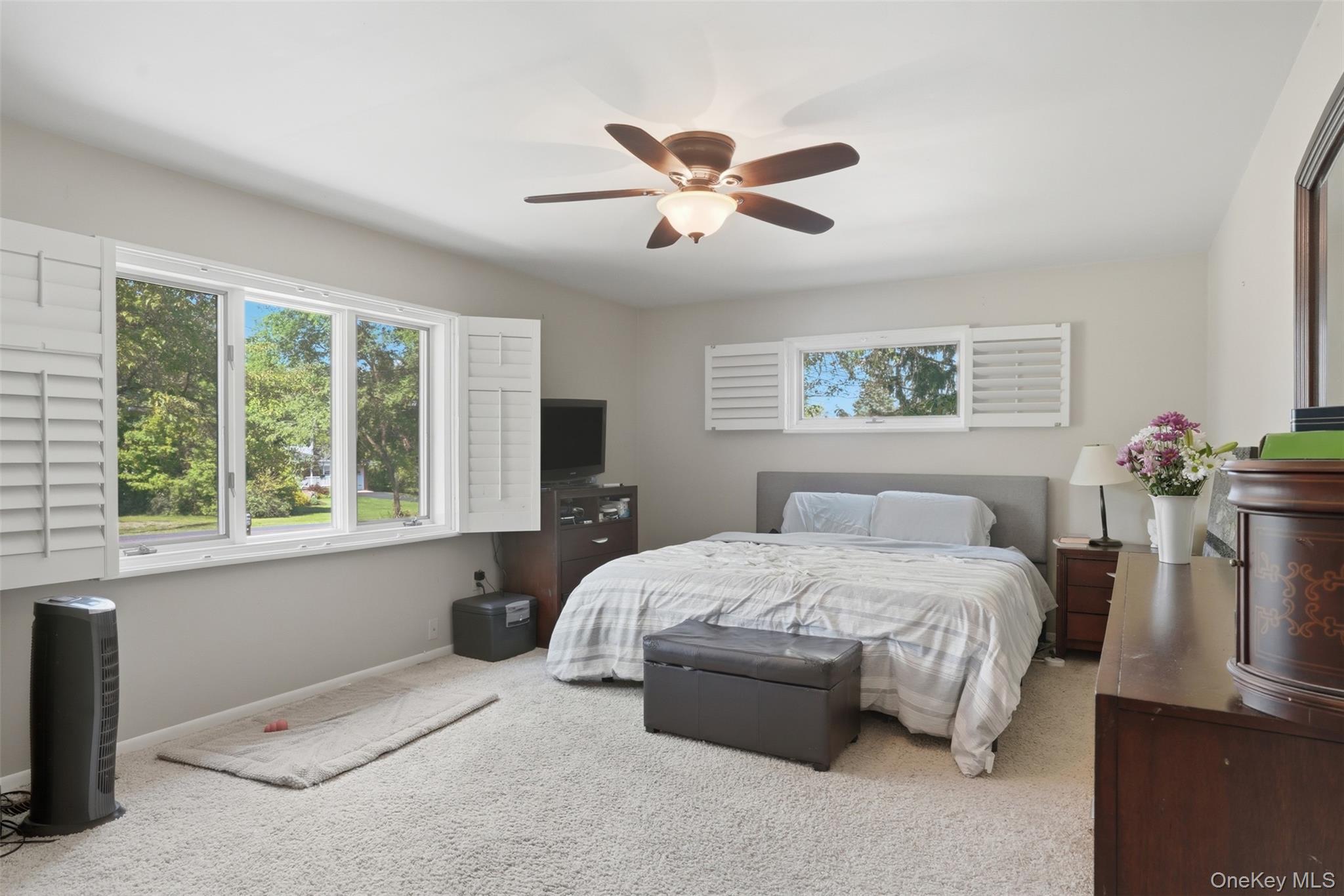 147 County Rte 1 Warwick, NY 10990 - Photo 17 of 45 a bedroom with a bed and a chandelier