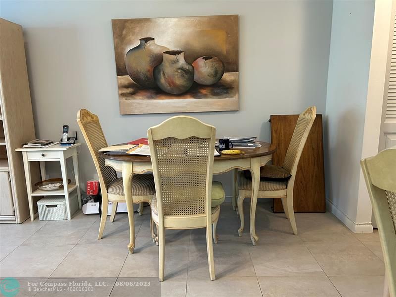 30 Tilford B, Unit 30 Deerfield Beach, FL 33442 - Photo 16 of 23 a dining room with furniture and natural light