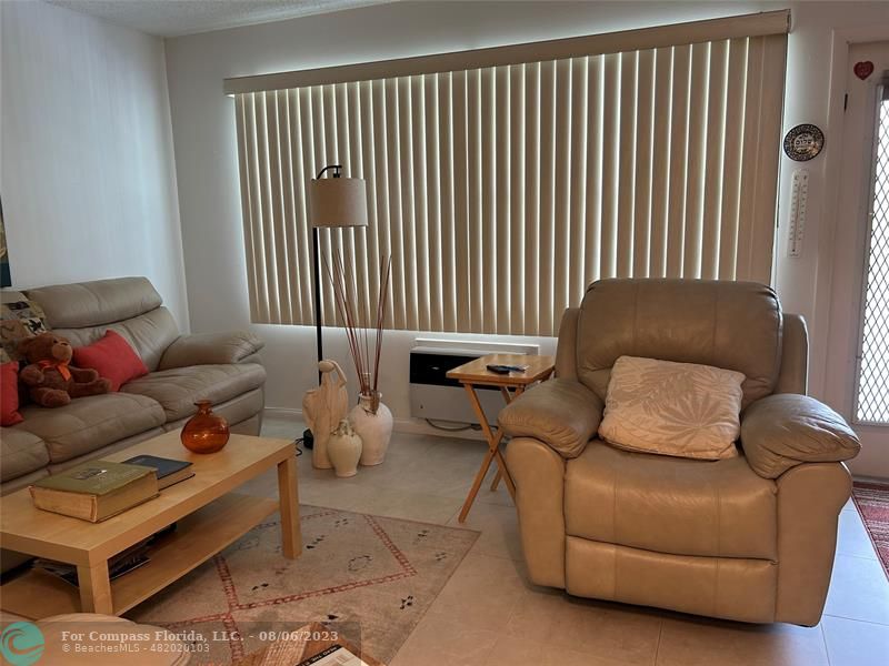 30 Tilford B, Unit 30 Deerfield Beach, FL 33442 - Photo 18 of 23 a living room with furniture and a window