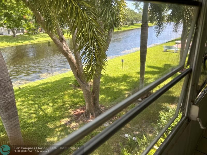 30 Tilford B, Unit 30 Deerfield Beach, FL 33442 - Photo 3 of 23 a view of a garden from a balcony