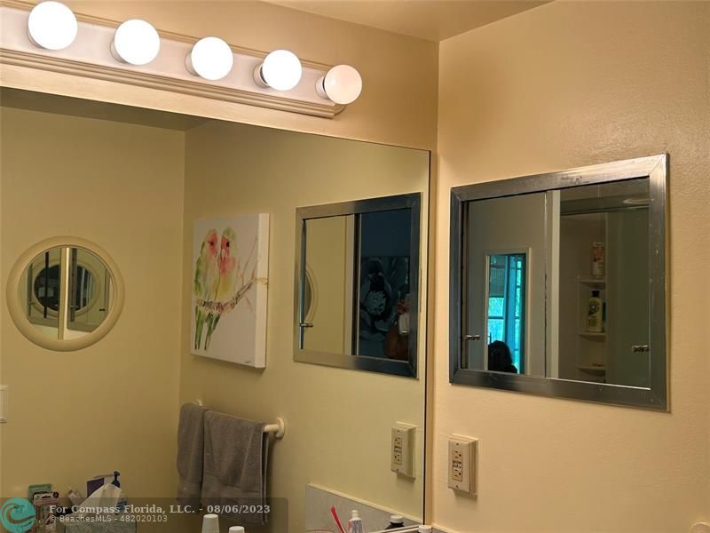 30 Tilford B, Unit 30 Deerfield Beach, FL 33442 - Photo 6 of 23 a bathroom with a sink and a mirror