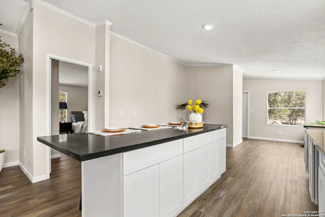 a kitchen with sink and window