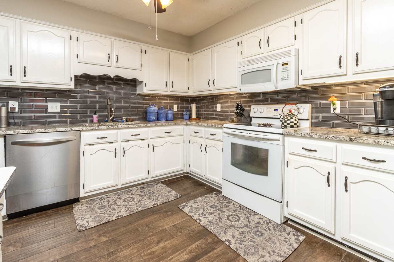 304 East White Road Collierville, TN 38017 - Photo 3 of 23 a kitchen with cabinets appliances and a sink