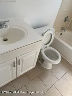 a bathroom with a toilet and a sink