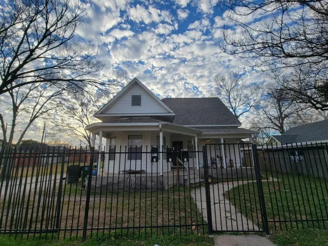 a view of a hallway with dining area and entryway