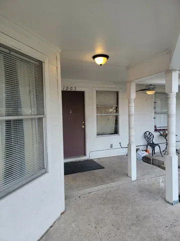 a view of a bathroom from a hallway