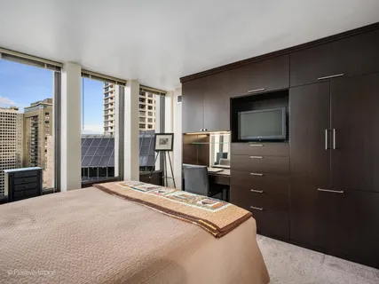 a bedroom with a bed and a television in it