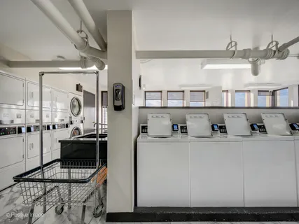 a kitchen with cabinets and window