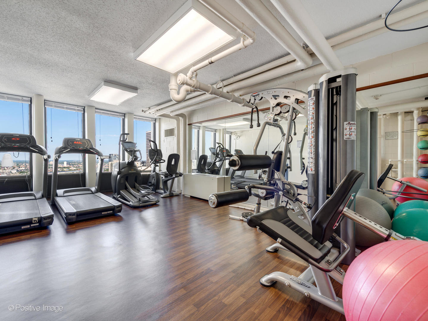 100 East Walton Street, Unit 32B Chicago, IL 60611 - Photo 17 of 17 a view of a livingroom with furniture and a flat screen tv