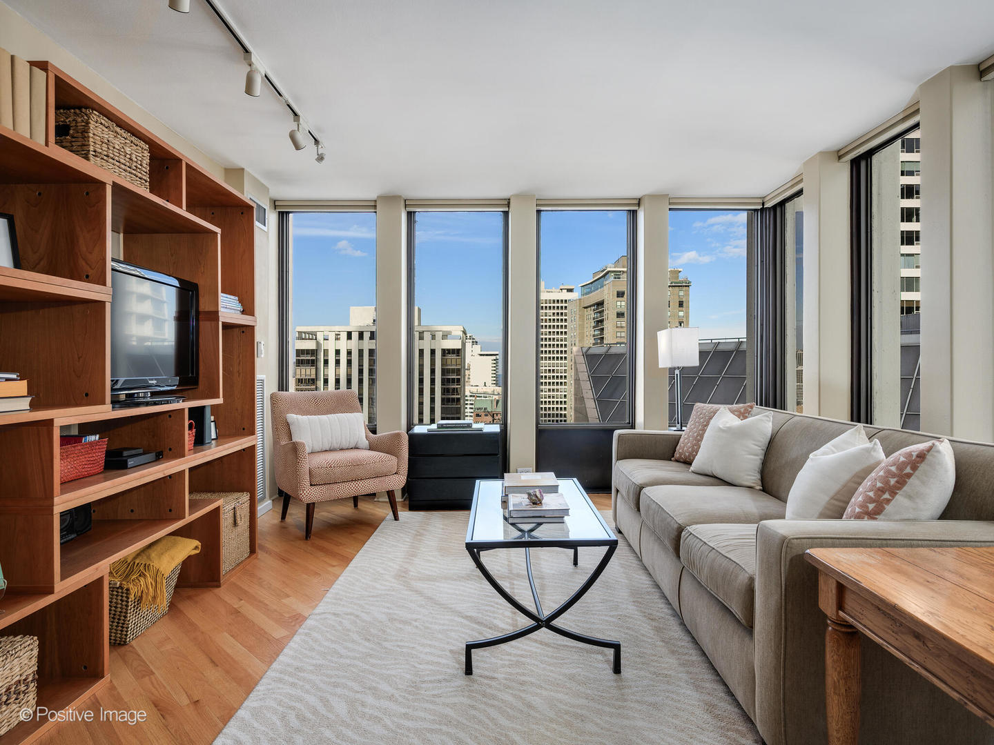 100 East Walton Street, Unit 32B Chicago, IL 60611 - Photo 4 of 17 a living room with furniture and a flat screen tv