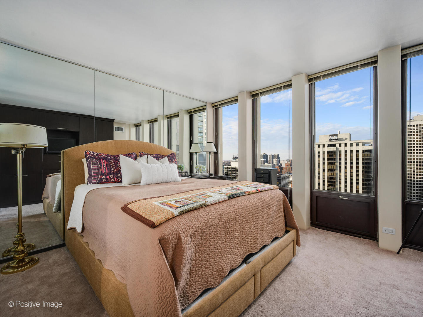 100 East Walton Street, Unit 32B Chicago, IL 60611 - Photo 10 of 17 a bedroom with a bed and a window