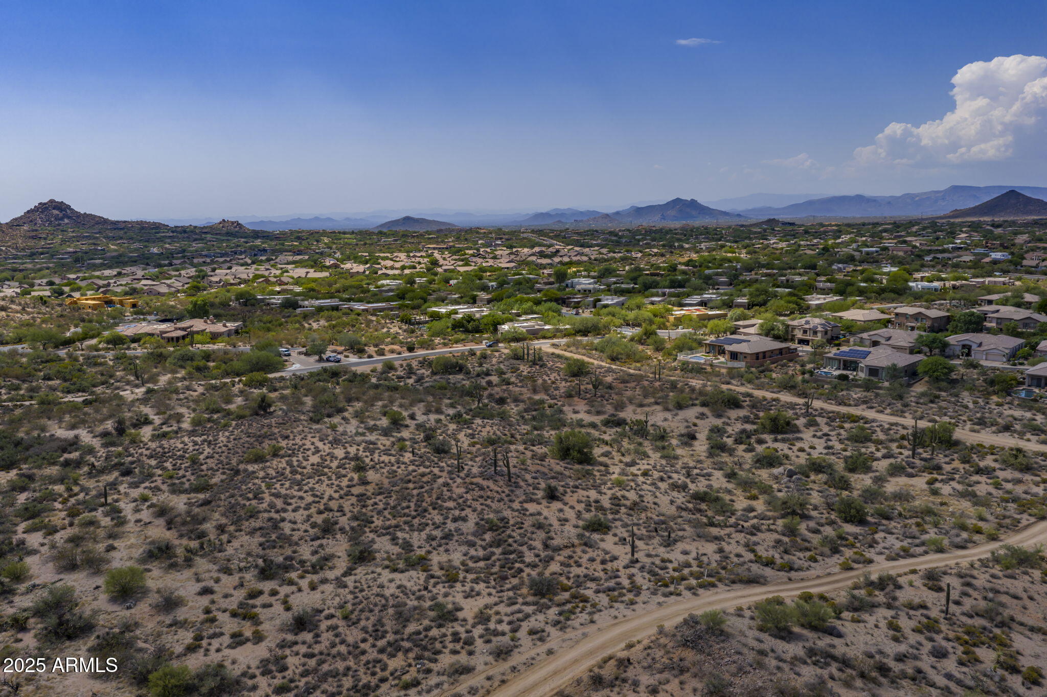11473 East Oberlin Way, Unit 20 Scottsdale, AZ 85262 - Photo 17 of 29 a view of a big yard with an outdoor space and seating area