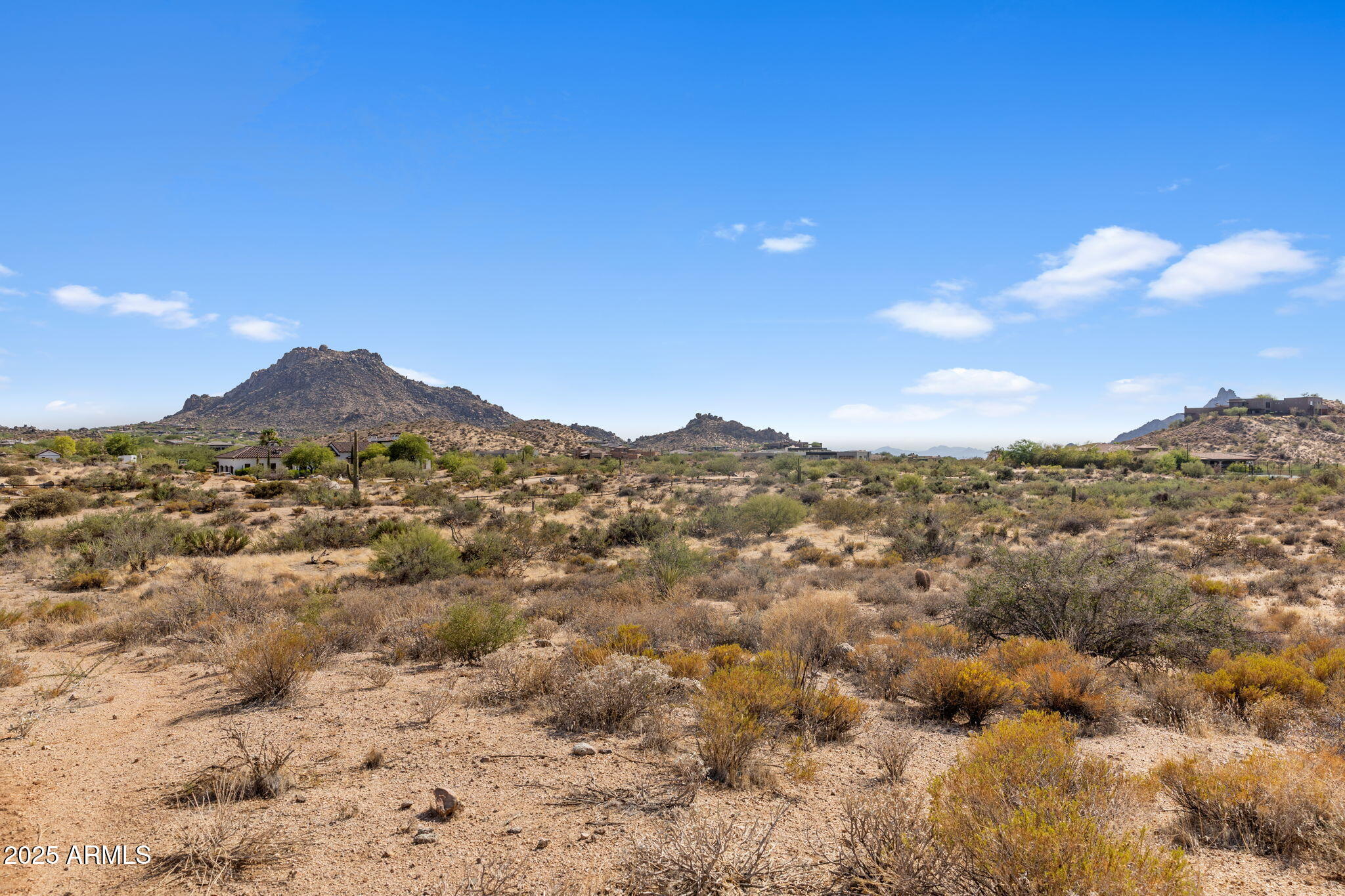 11473 East Oberlin Way, Unit 20 Scottsdale, AZ 85262 - Photo 5 of 29 a view of a dry yard with mountains in the background