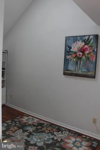 a view of a small room with wooden floor