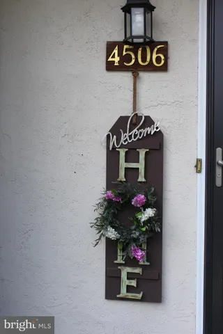 a view of a entryway with a flower pot and a table