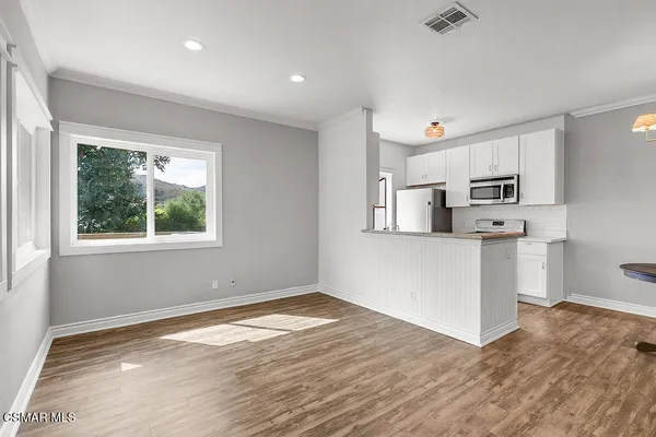 a kitchen with a stove and a microwave