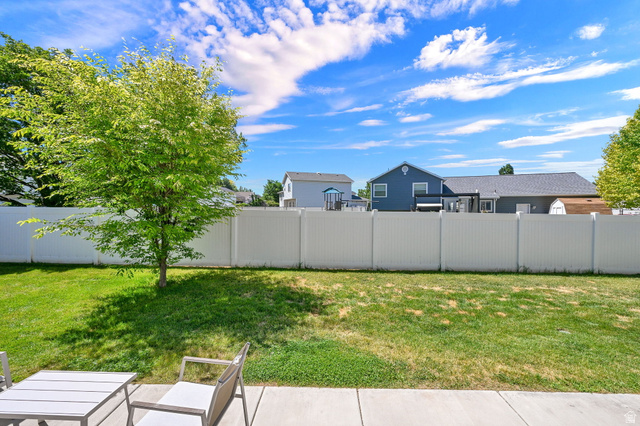 2777 West 4175th Street South, Unit 232 Roy, UT 84067 - Photo 3 of 27 Backyard shared fencing with Single family homes, providing more privacy.