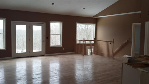 11 Griggs Road Sutton, MA 01590 - Photo 20 of 23 a view of an empty room with wooden floor and a window