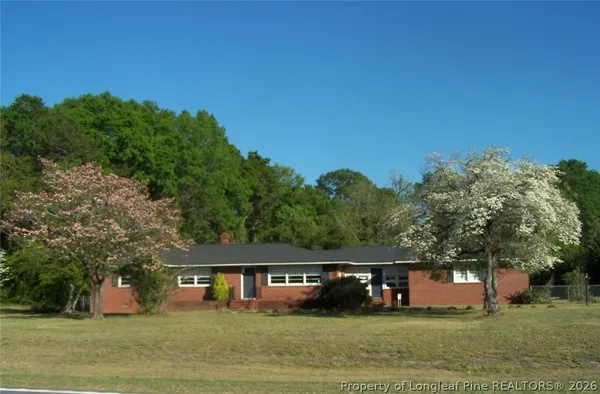 a view of house with outdoor space