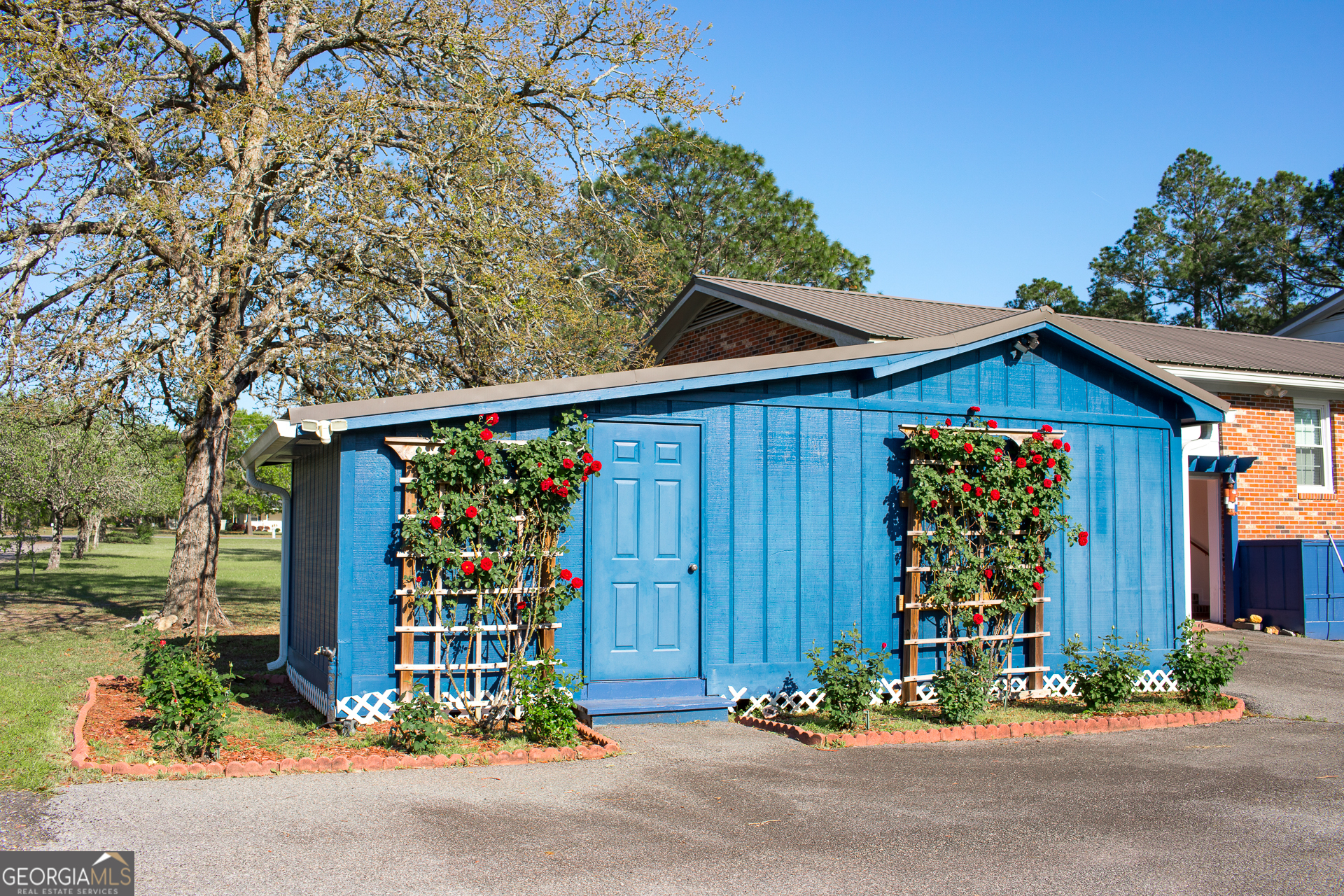 2110 Ware Street Blackshear, GA 31516 - Photo 7 of 57 a front view of a house with garden