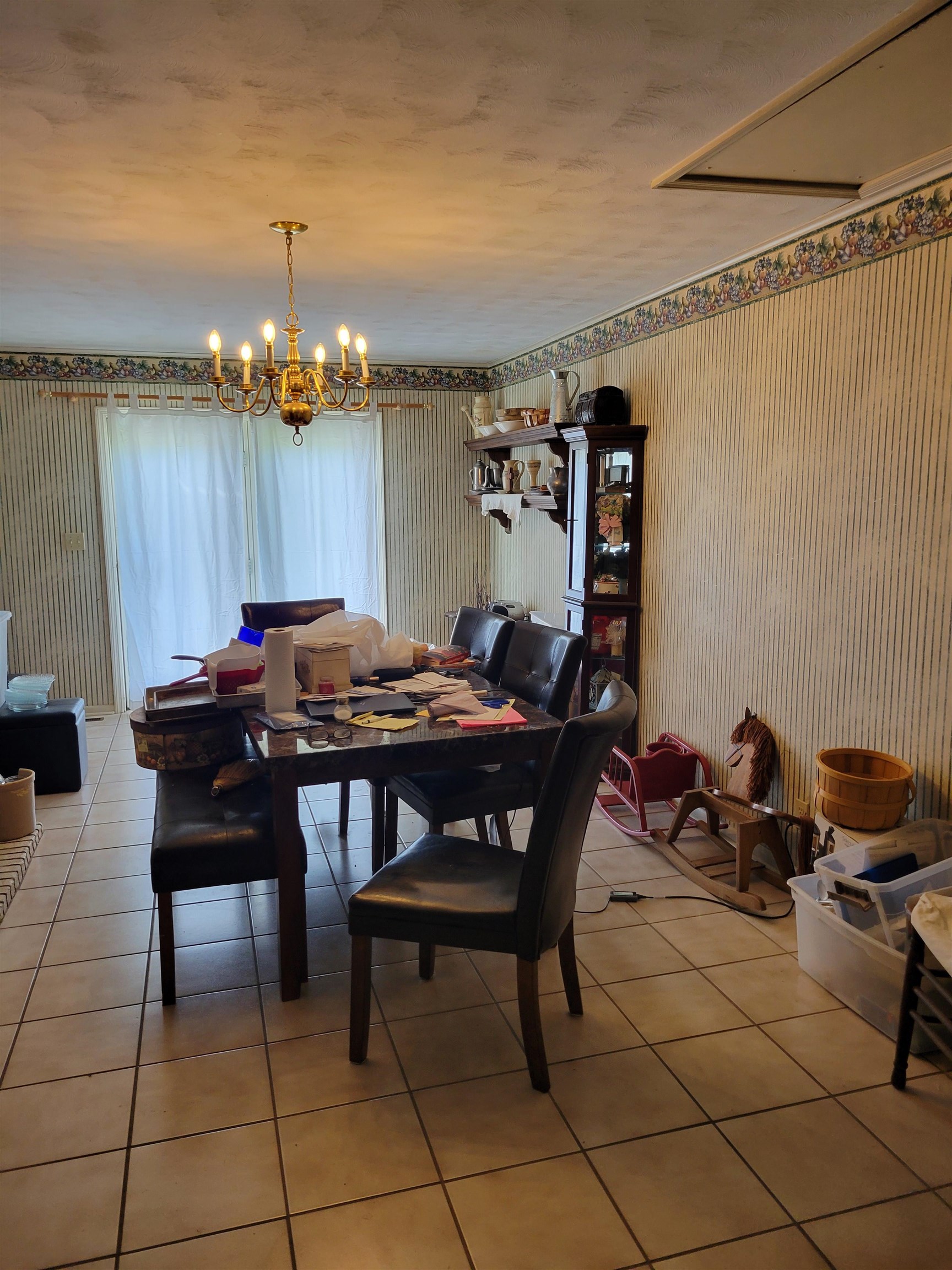 15930 Edith-Nankipoo Road Halls, TN 38040 - Photo 6 of 7 Dining space featuring tile patterned floors and a chandelier
