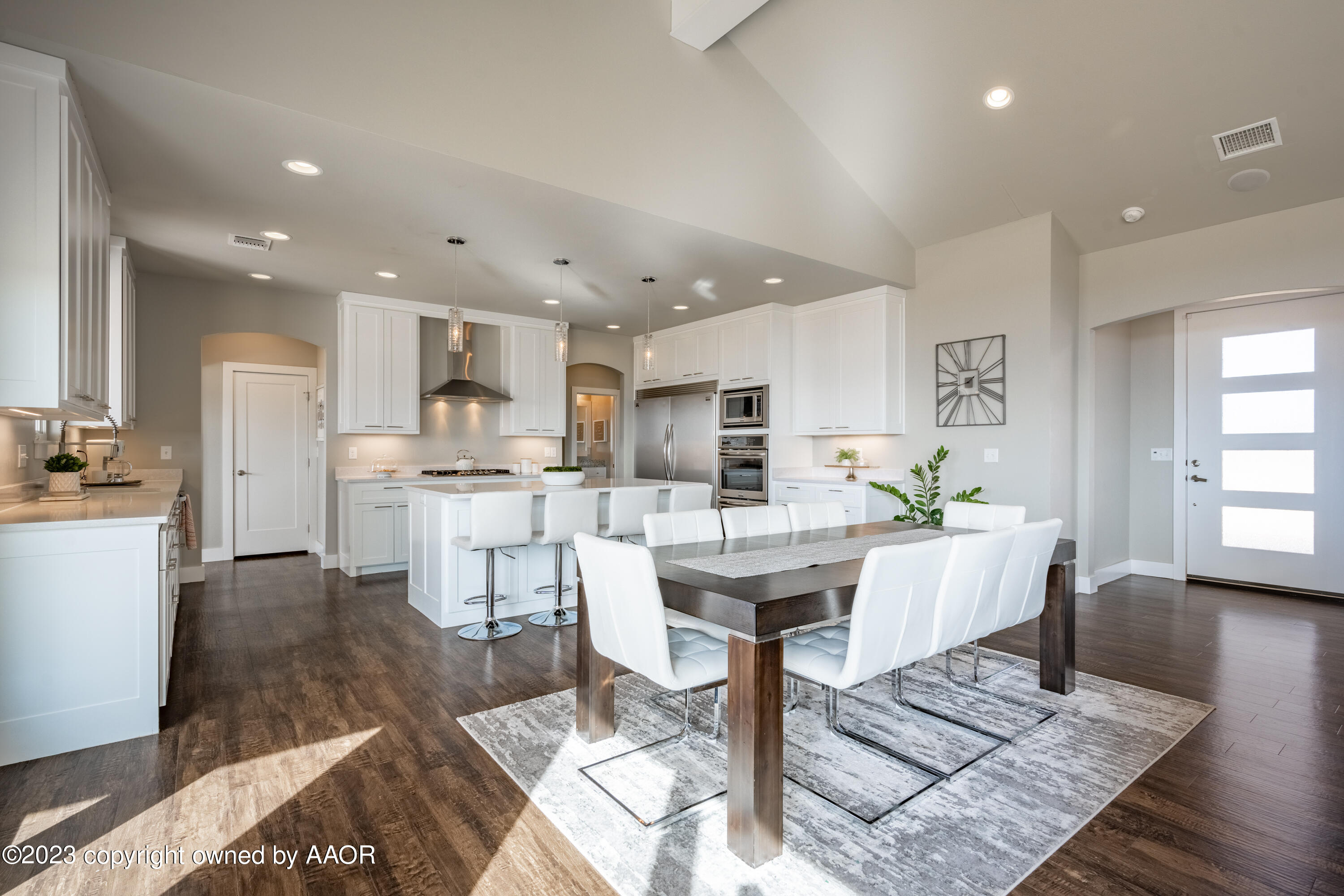 15300 Canyon Pass Road Amarillo, TX 79118 - Photo 12 of 51 a living room with stainless steel appliances furniture dining table and wooden floor