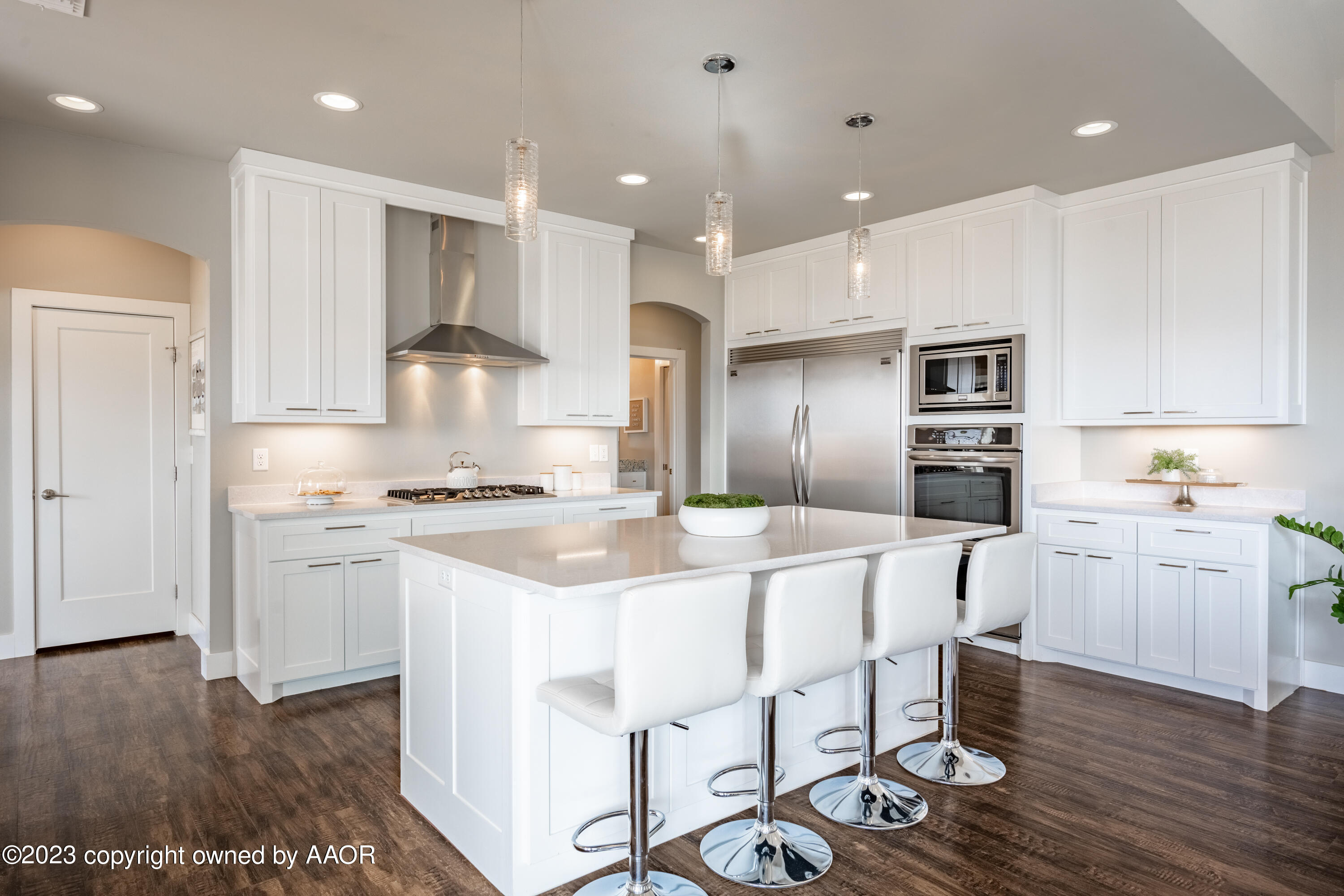 15300 Canyon Pass Road Amarillo, TX 79118 - Photo 13 of 51 a large kitchen with kitchen island a sink table and chairs