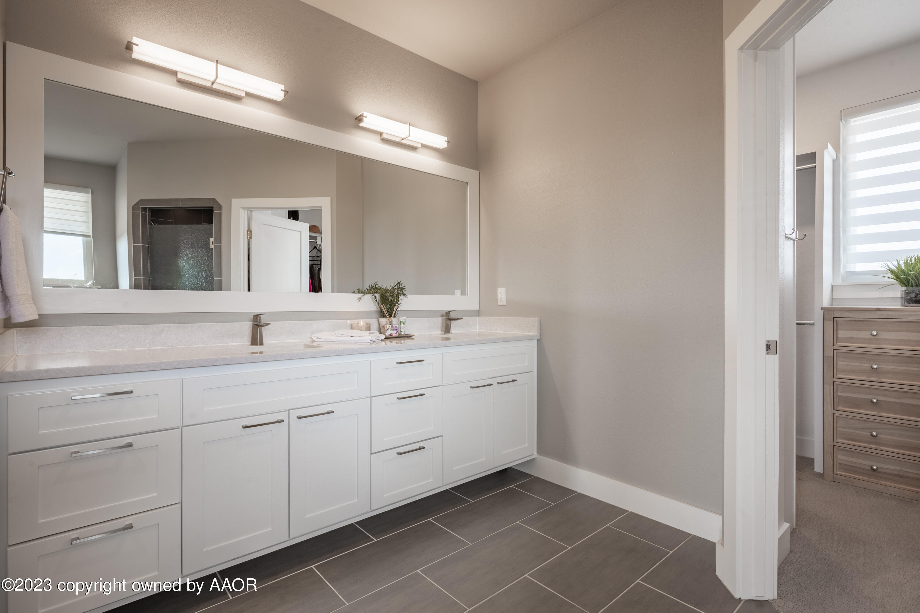 15300 Canyon Pass Road Amarillo, TX 79118 - Photo 24 of 51 a spacious bathroom with a double vanity sink mirror and next