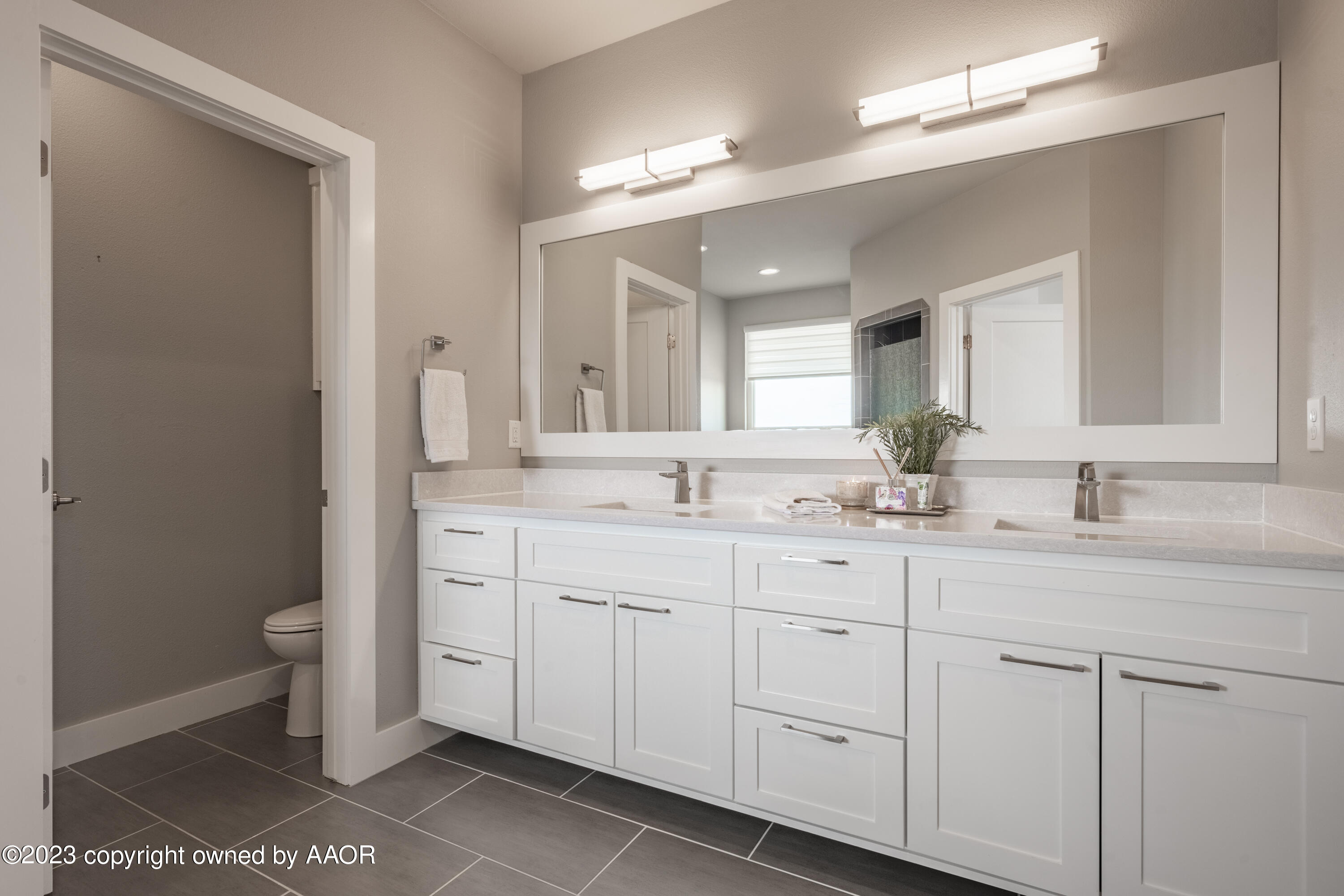 15300 Canyon Pass Road Amarillo, TX 79118 - Photo 25 of 51 a bathroom with a double vanity sink and a mirror