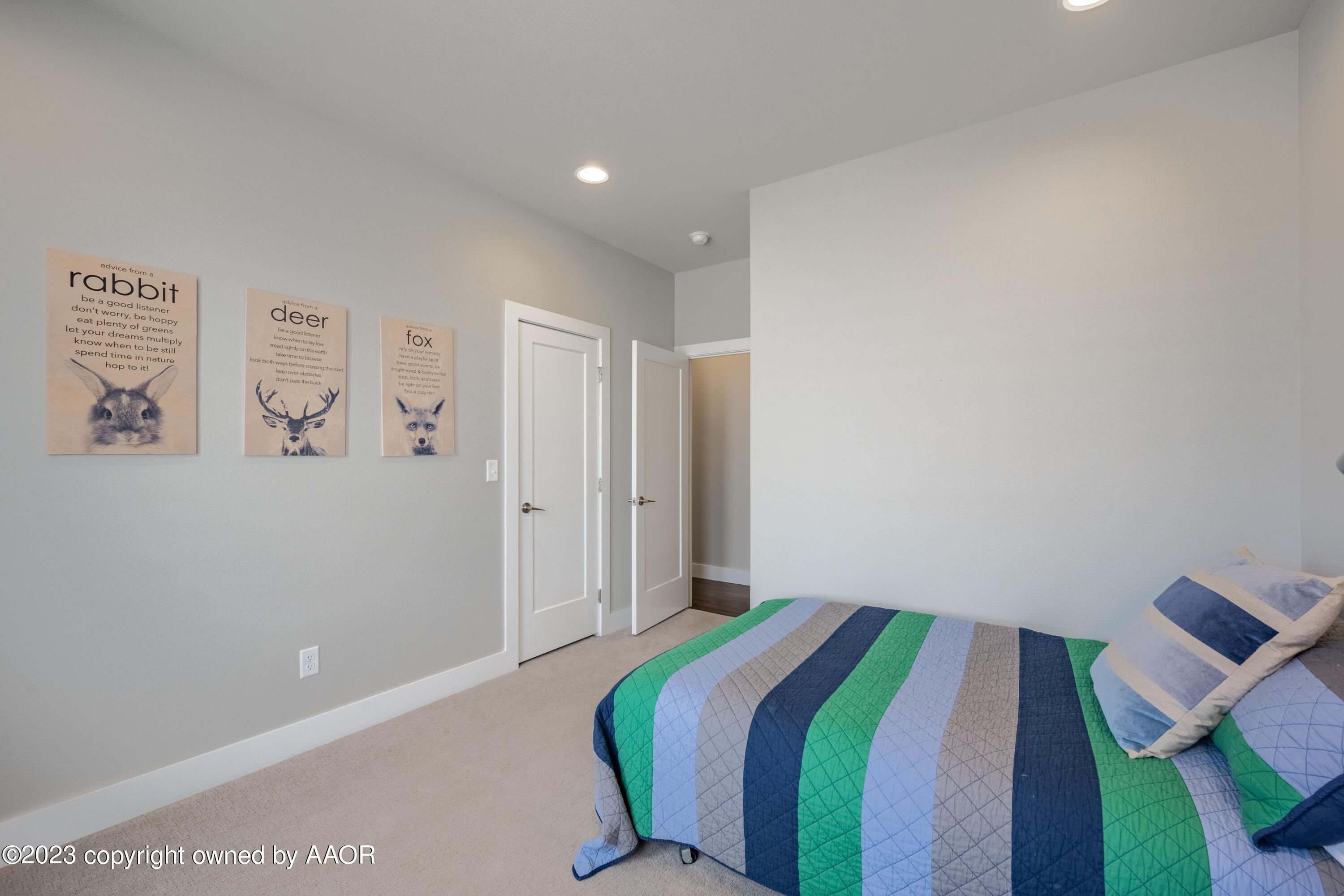 15300 Canyon Pass Road Amarillo, TX 79118 - Photo 28 of 51 a bedroom with a bed and painting on the wall