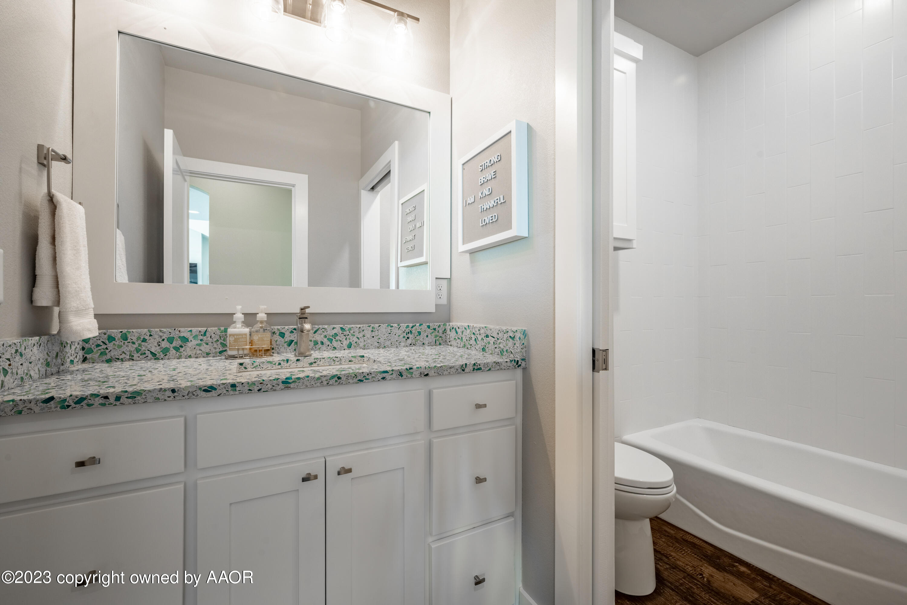 15300 Canyon Pass Road Amarillo, TX 79118 - Photo 31 of 51 a bathroom with a granite countertop sink a toilet and a bathtub