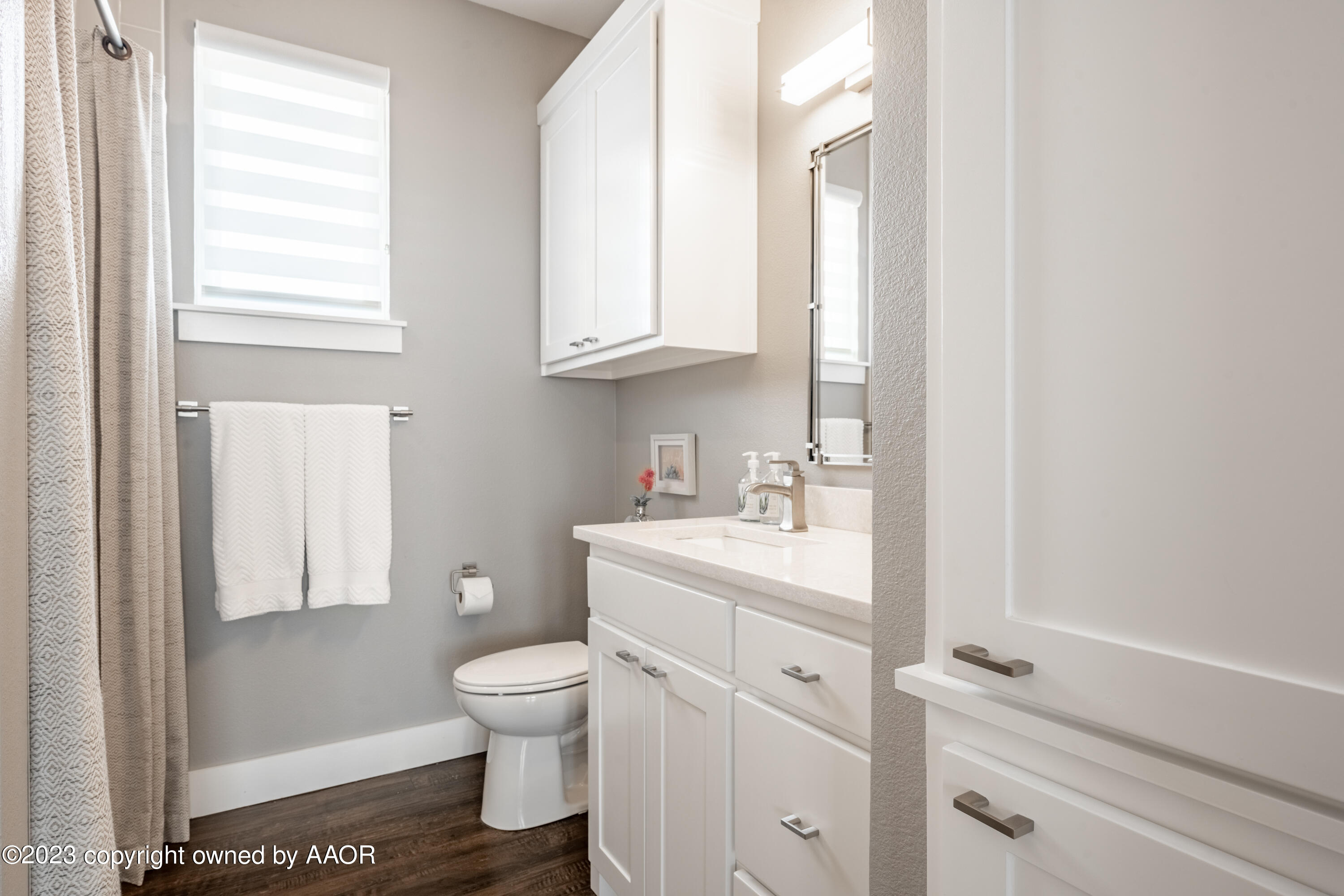 15300 Canyon Pass Road Amarillo, TX 79118 - Photo 34 of 51 a bathroom with a granite countertop sink a toilet and a window