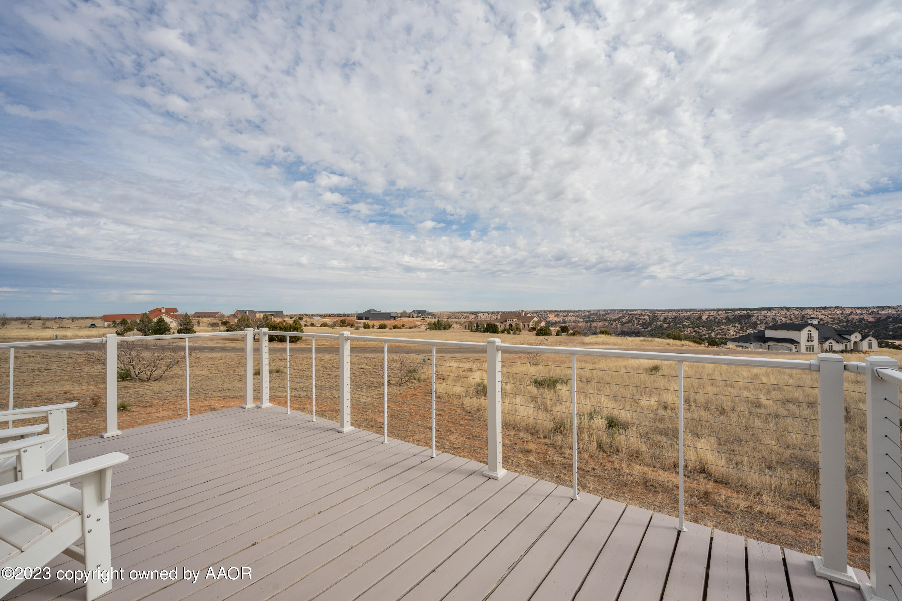 15300 Canyon Pass Road Amarillo, TX 79118 - Photo 38 of 51 a view of a balcony with wooden floor and fence