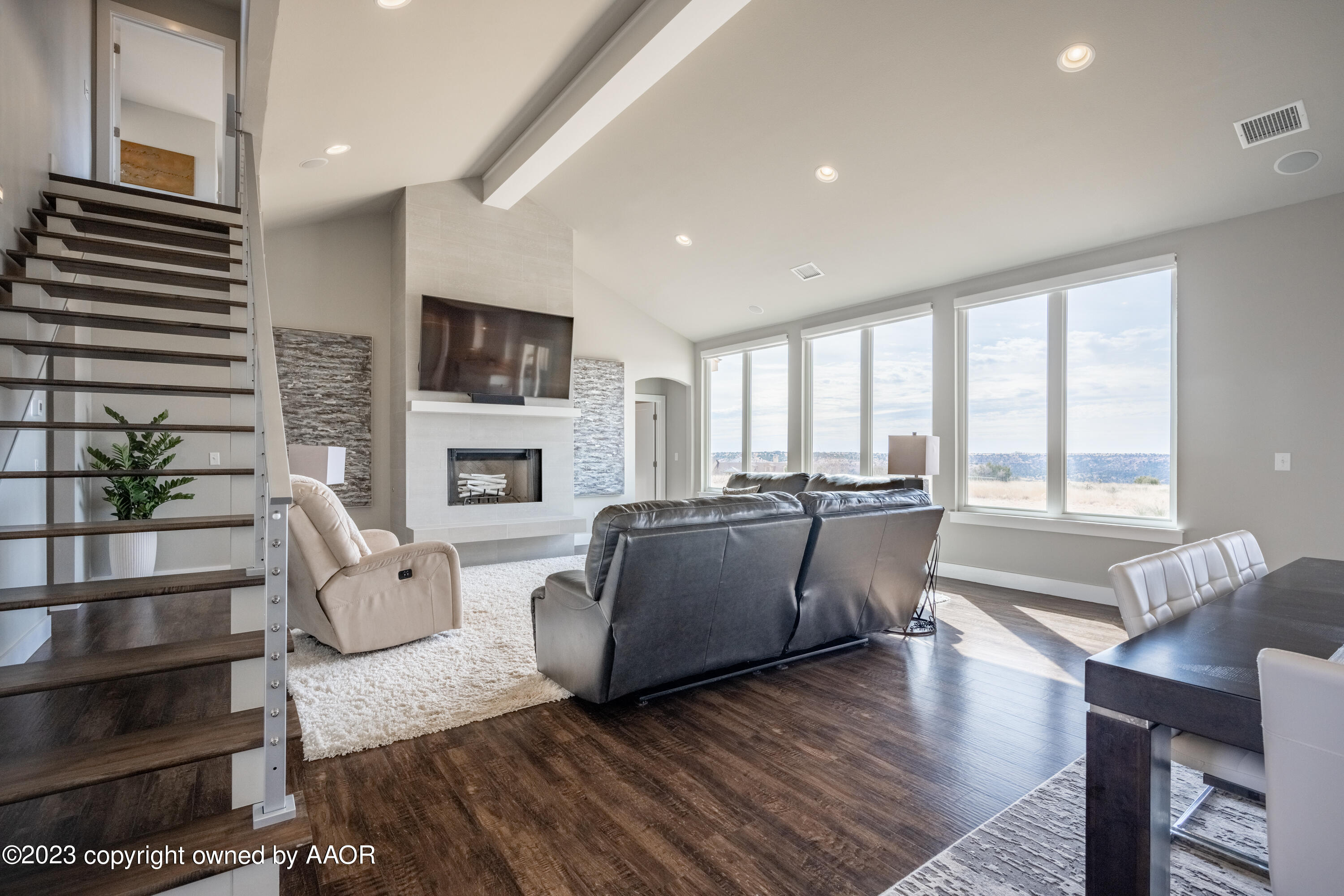 15300 Canyon Pass Road Amarillo, TX 79118 - Photo 4 of 51 a living room with fireplace furniture and a flat screen tv