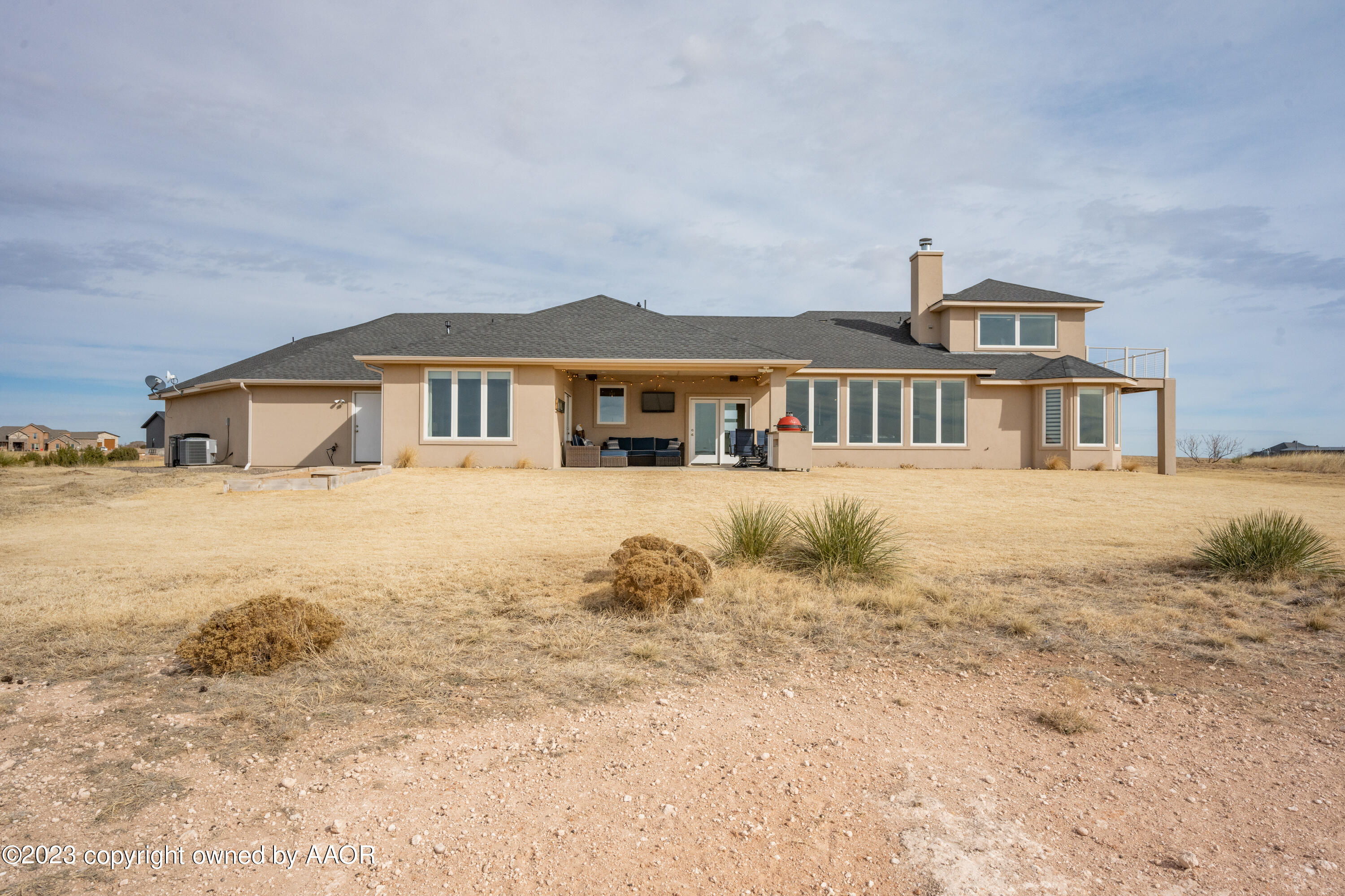 15300 Canyon Pass Road Amarillo, TX 79118 - Photo 49 of 51 a front view of a house with a yard