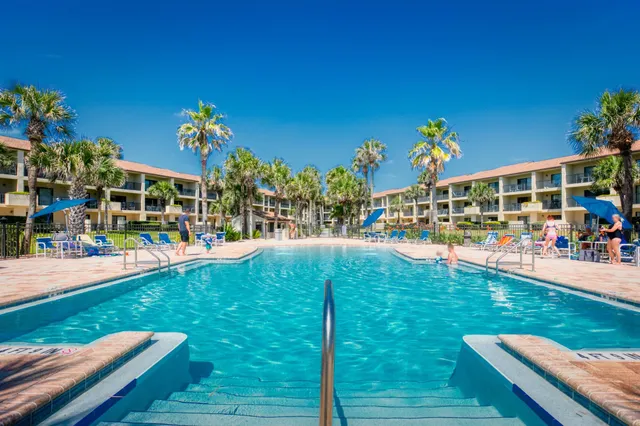 a view of a chairs and table in a patio