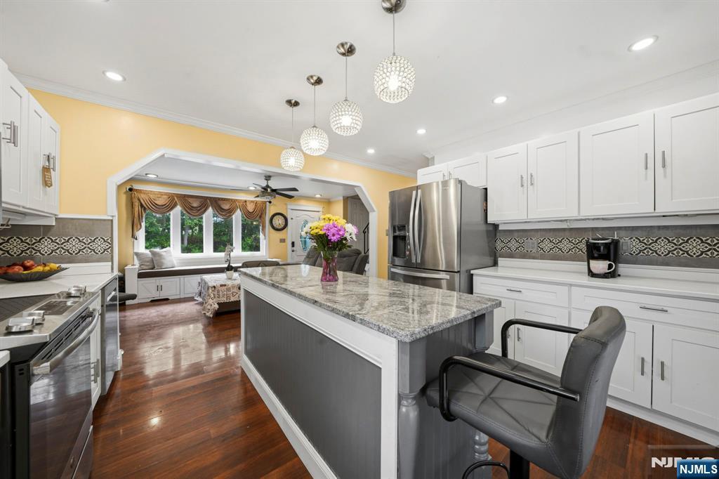 52 Barbara Drive Pompton Lakes, NJ 07442 - Photo 11 of 30 a kitchen with stainless steel appliances granite countertop sink stove and refrigerator