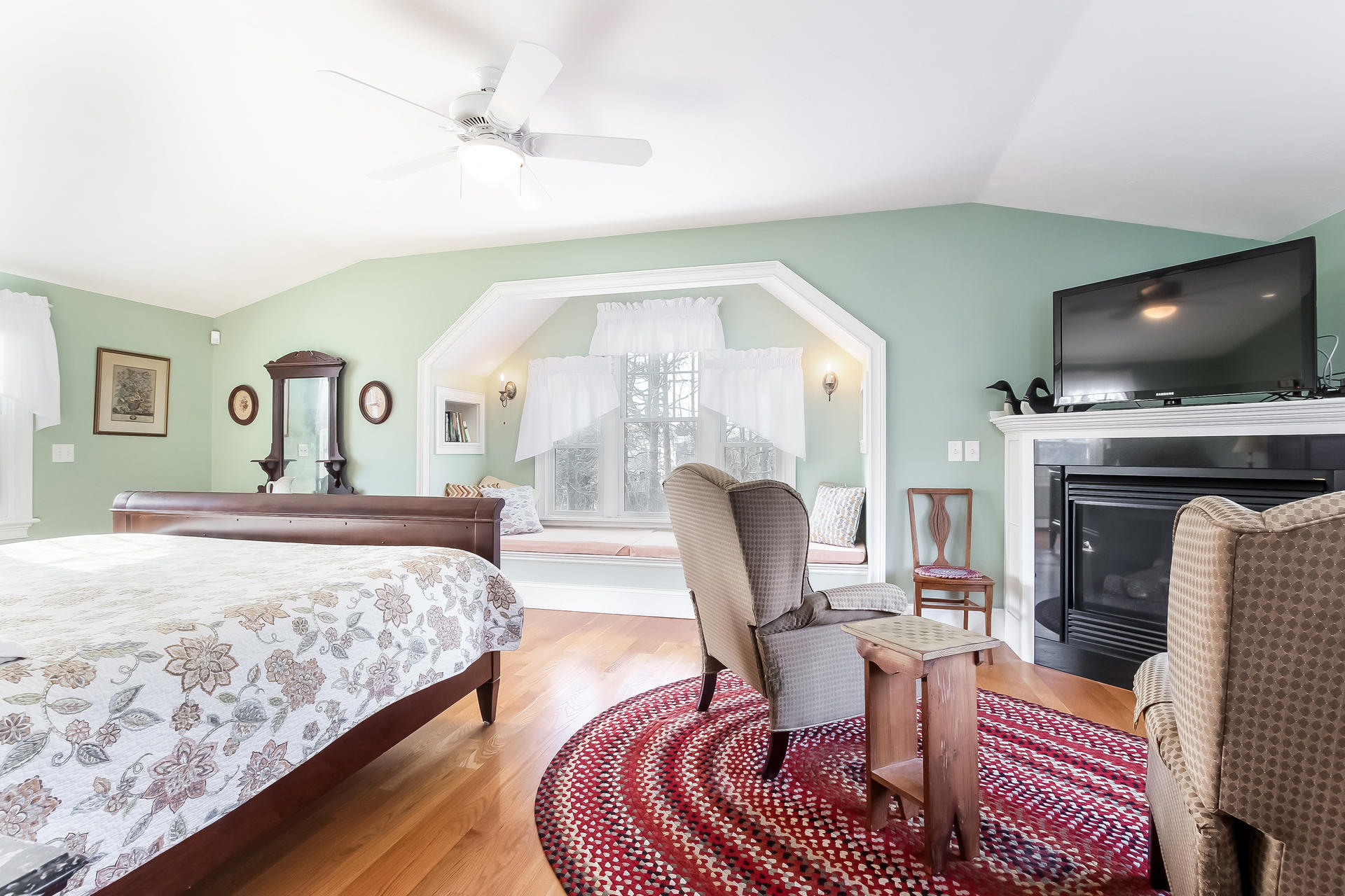 79 Stoney Point Road Cummaquid, MA 02675 - Photo 15 of 34 a bedroom with a bed and a flat screen tv