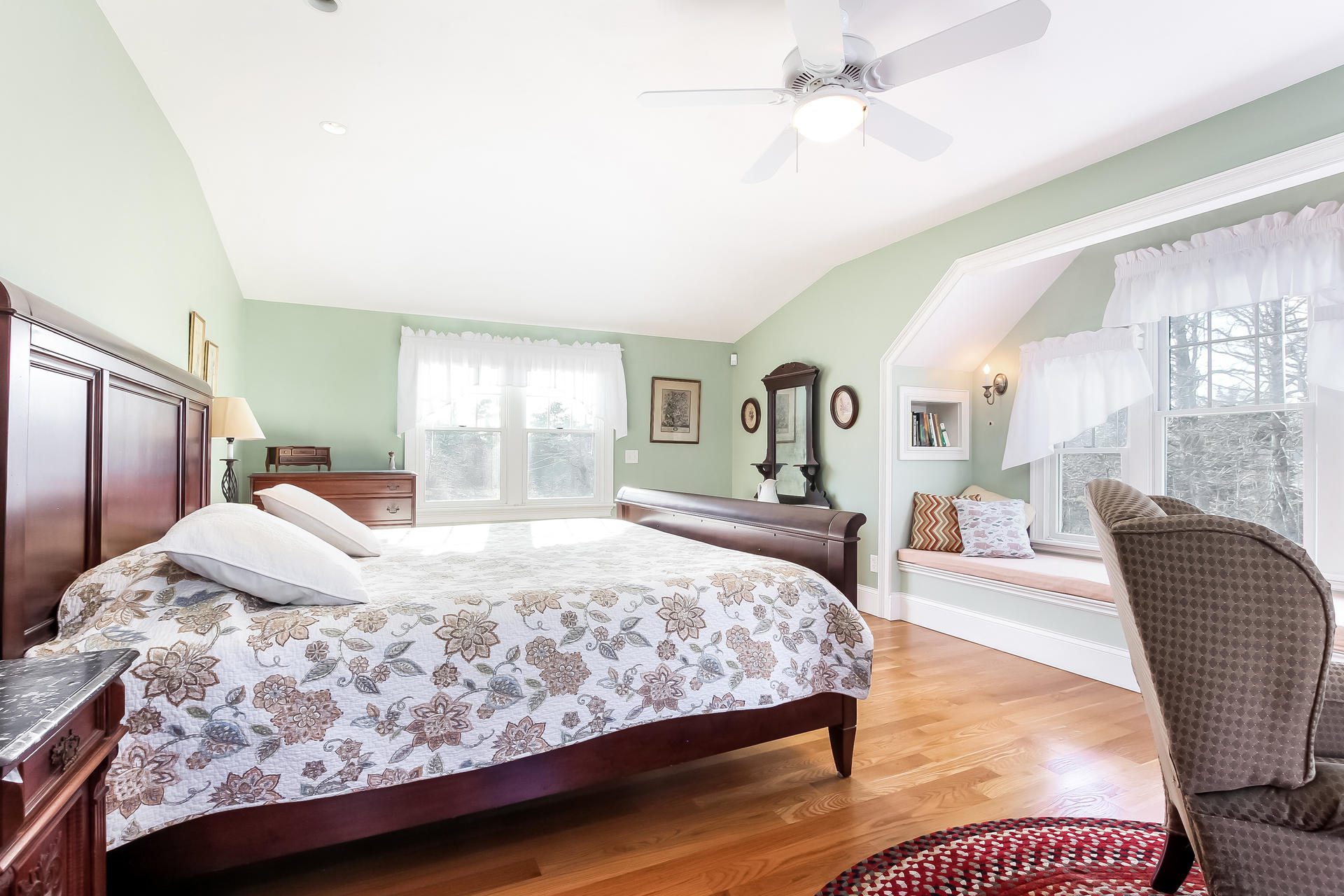 79 Stoney Point Road Cummaquid, MA 02675 - Photo 16 of 34 a bedroom with a large bed and a chandelier