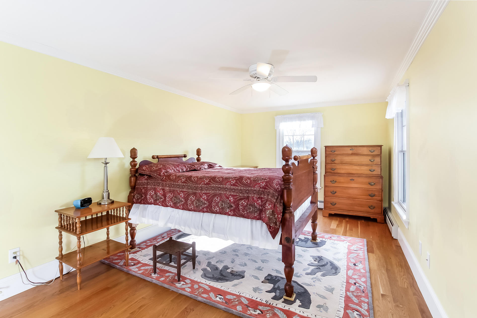 79 Stoney Point Road Cummaquid, MA 02675 - Photo 18 of 34 a bed room with a bed mirror and a chair