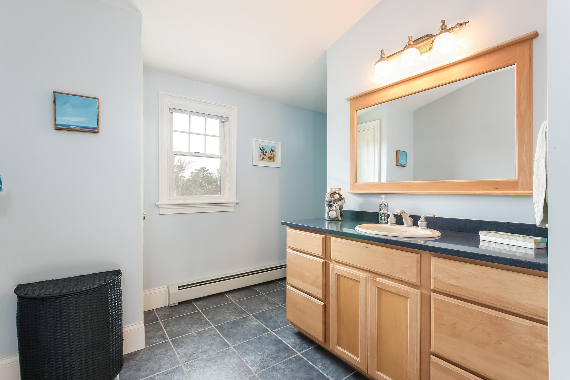 79 Stoney Point Road Cummaquid, MA 02675 - Photo 19 of 34 a bathroom with a granite countertop sink a mirror and a window