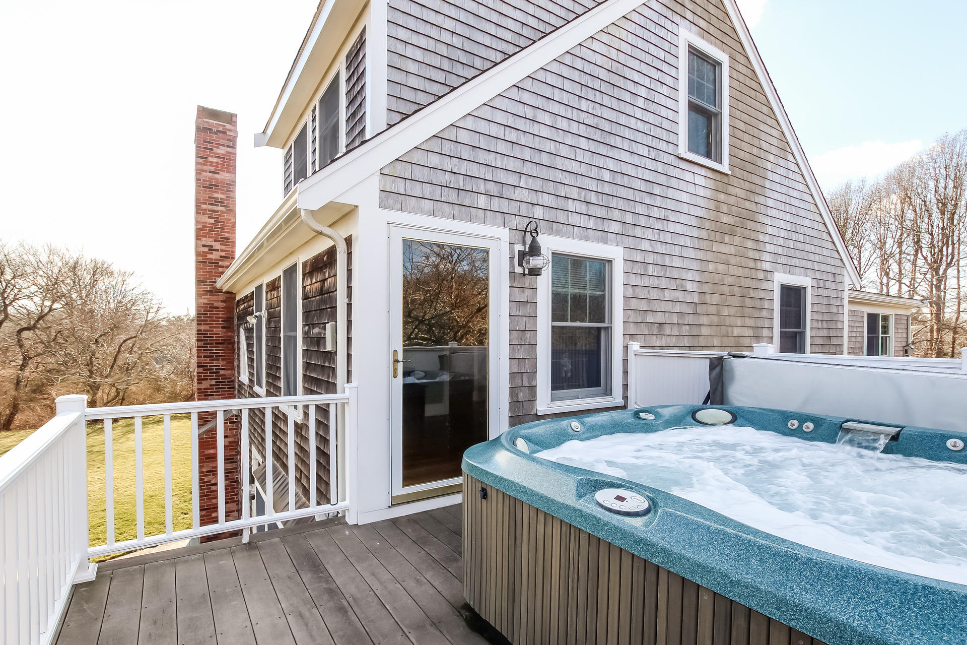 79 Stoney Point Road Cummaquid, MA 02675 - Photo 21 of 34 a view of a house with a small deck