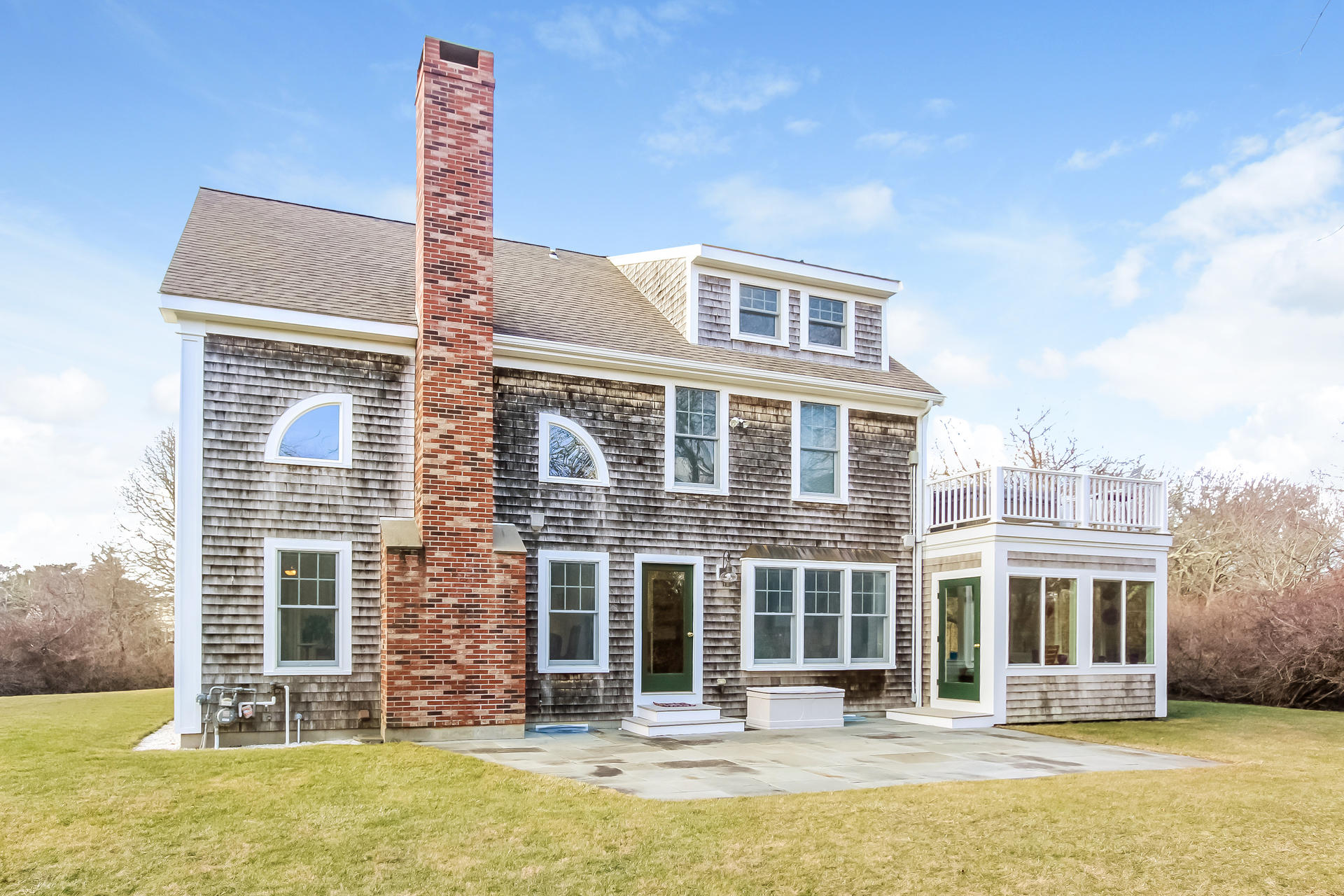 79 Stoney Point Road Cummaquid, MA 02675 - Photo 25 of 34 a front view of a building with a swimming pool